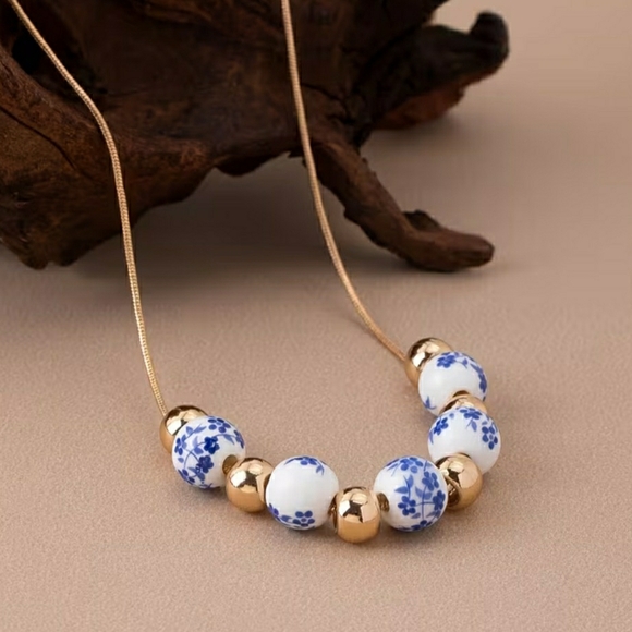 Blueberi Boulevard Jewelry - Blueberi Boulevard Gold and White Beaded Necklace